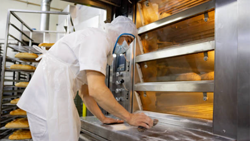 Cleaning a commercial oven after baking